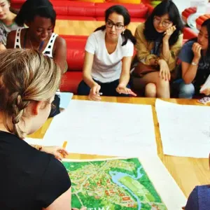 New Smith students gather around a campus map